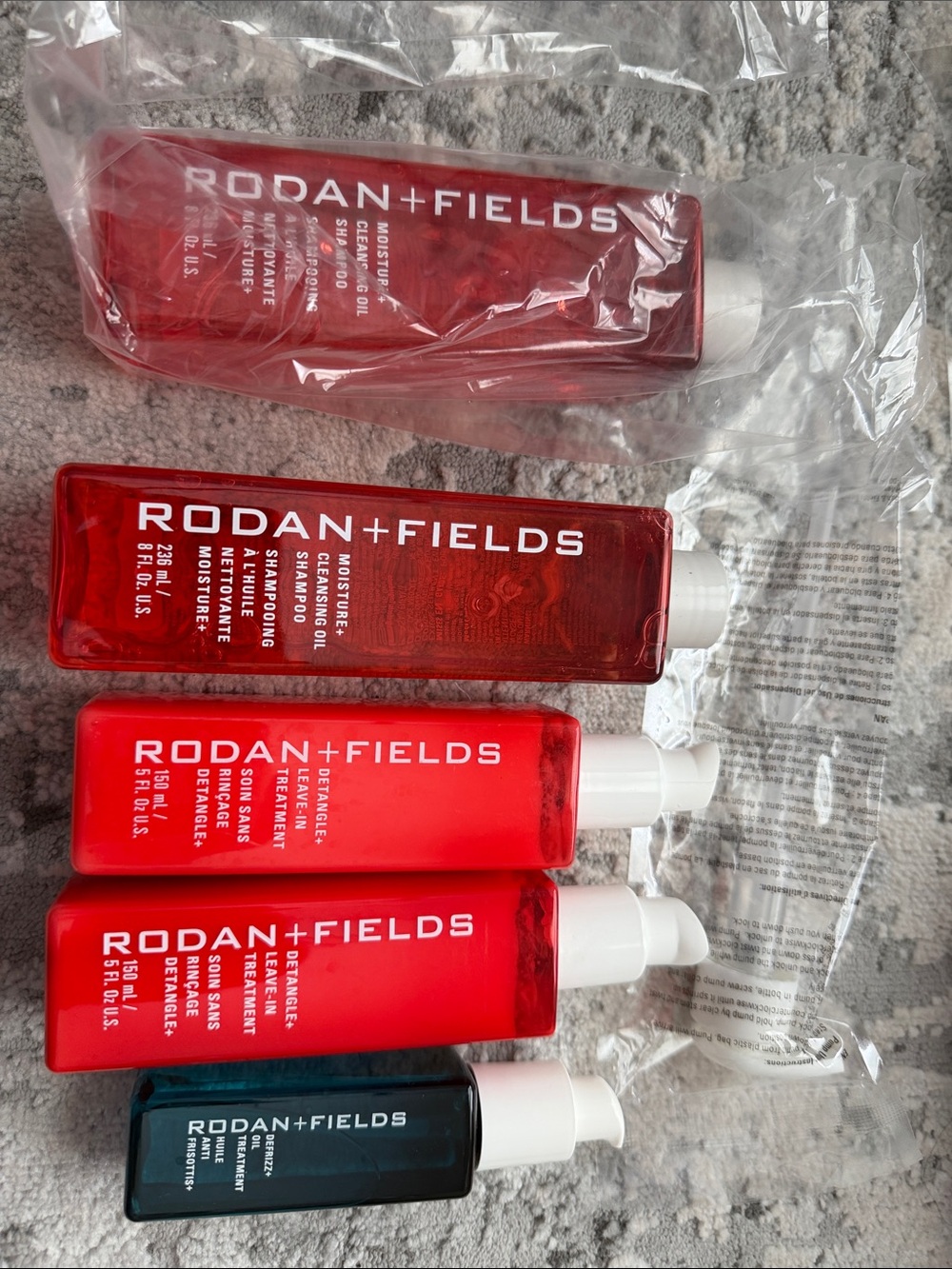 Rodan + Fields Red and Deep Teal Skincare Cleansers & Treatments Set
